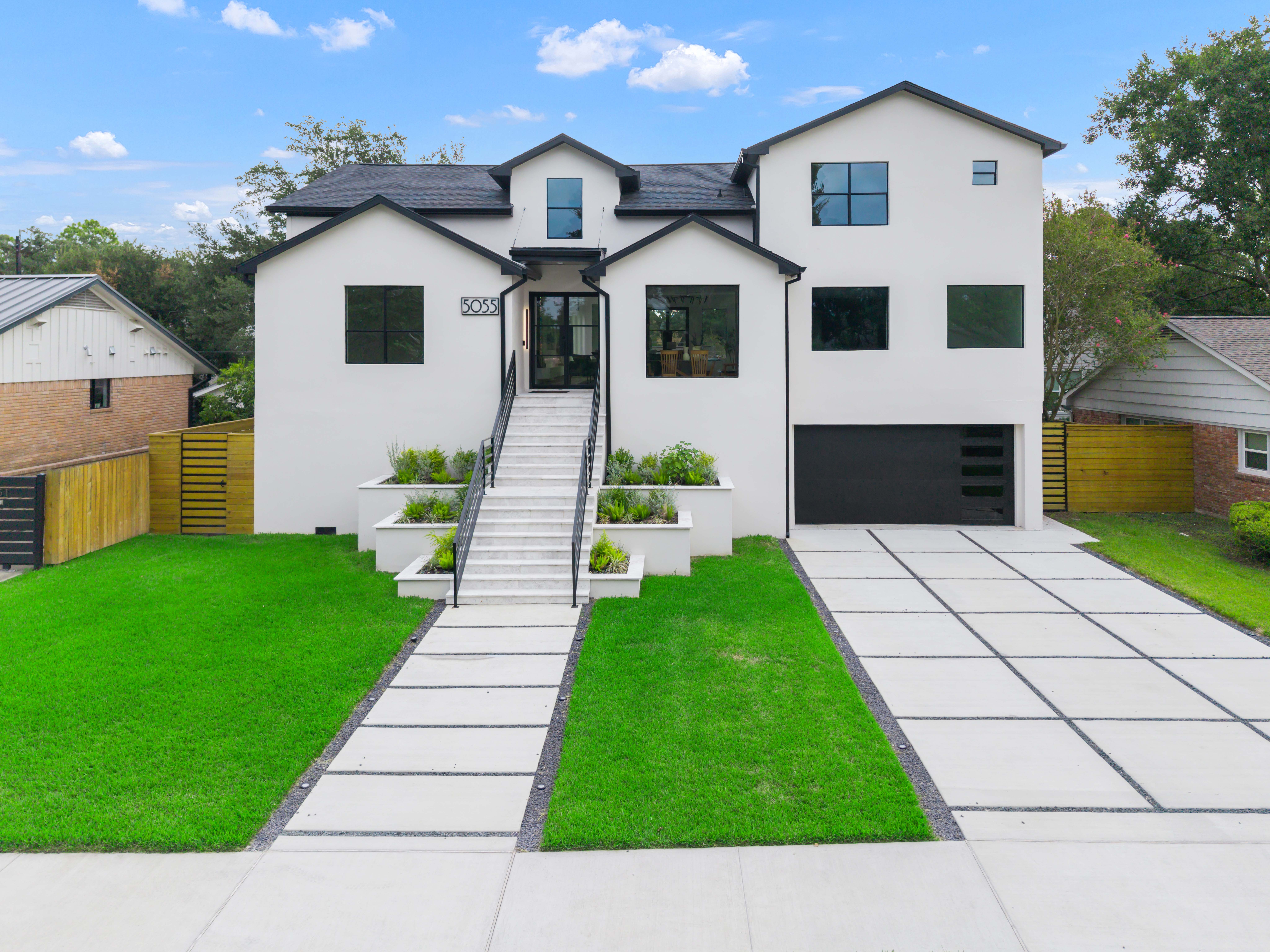 Real estate photography — front exterior of a modern two-story home