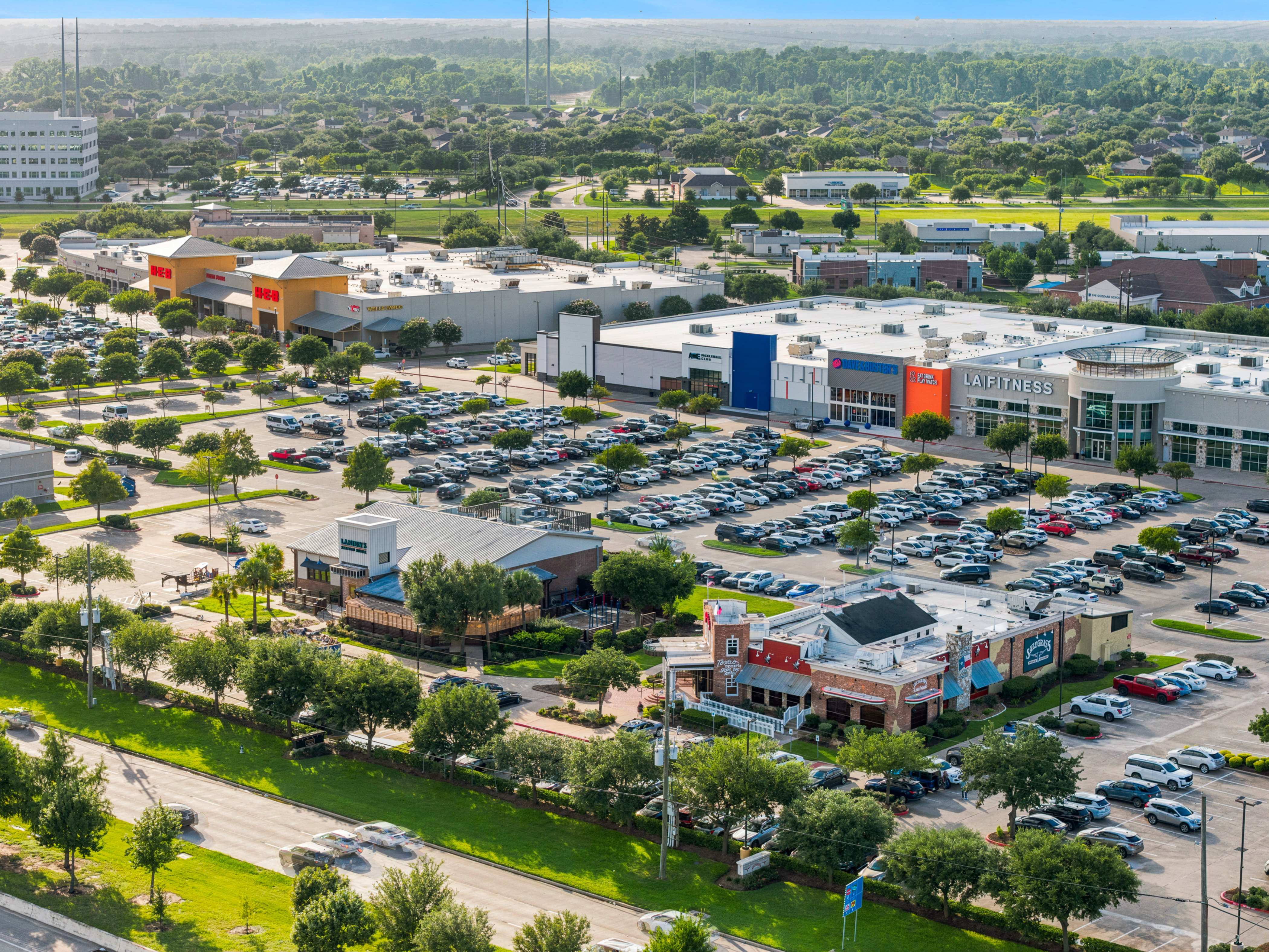 Aerial photograph of Houston townhomes with downtown skyline in the distance