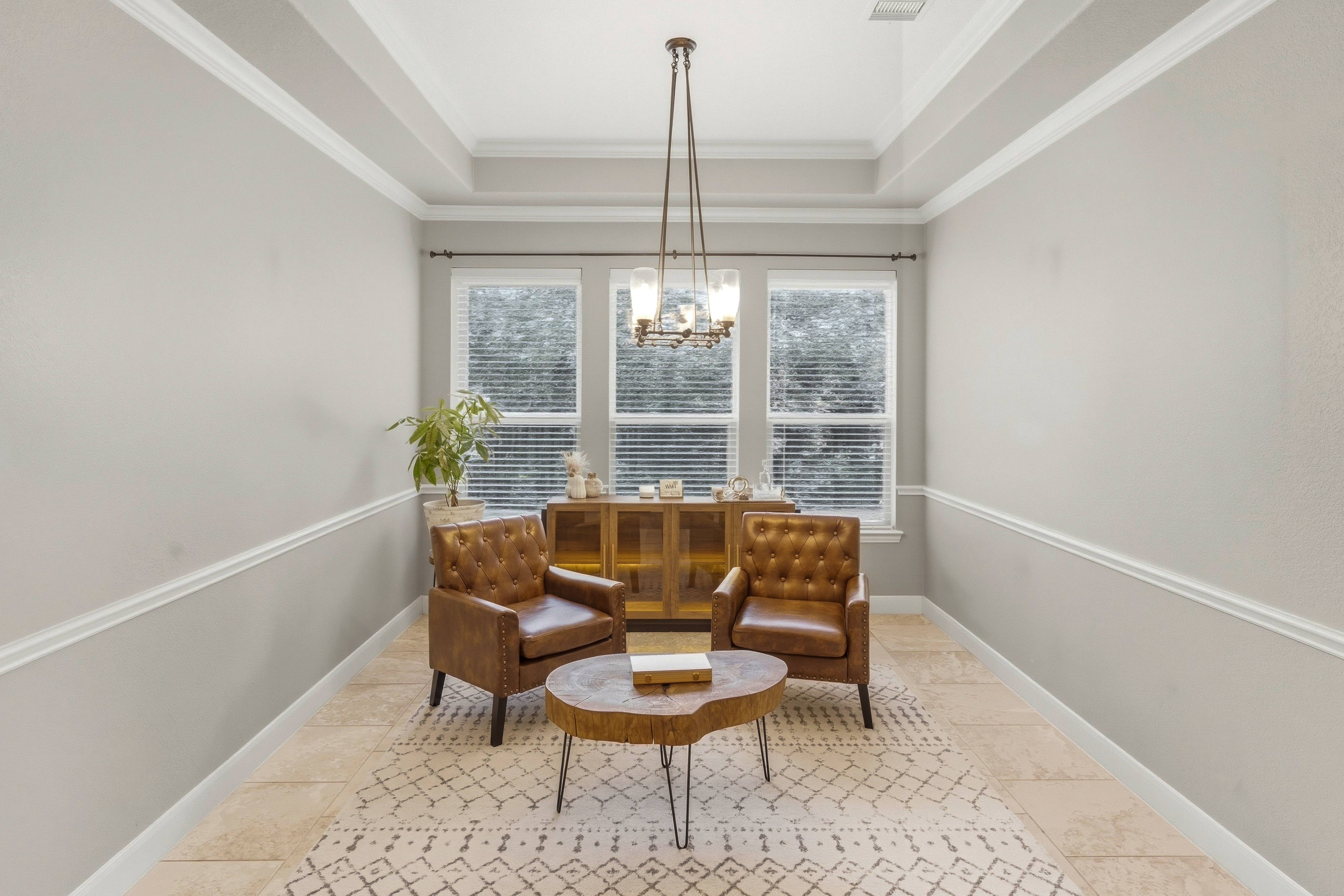 Cozy sitting room with leather armchairs and a live-edge coffee table