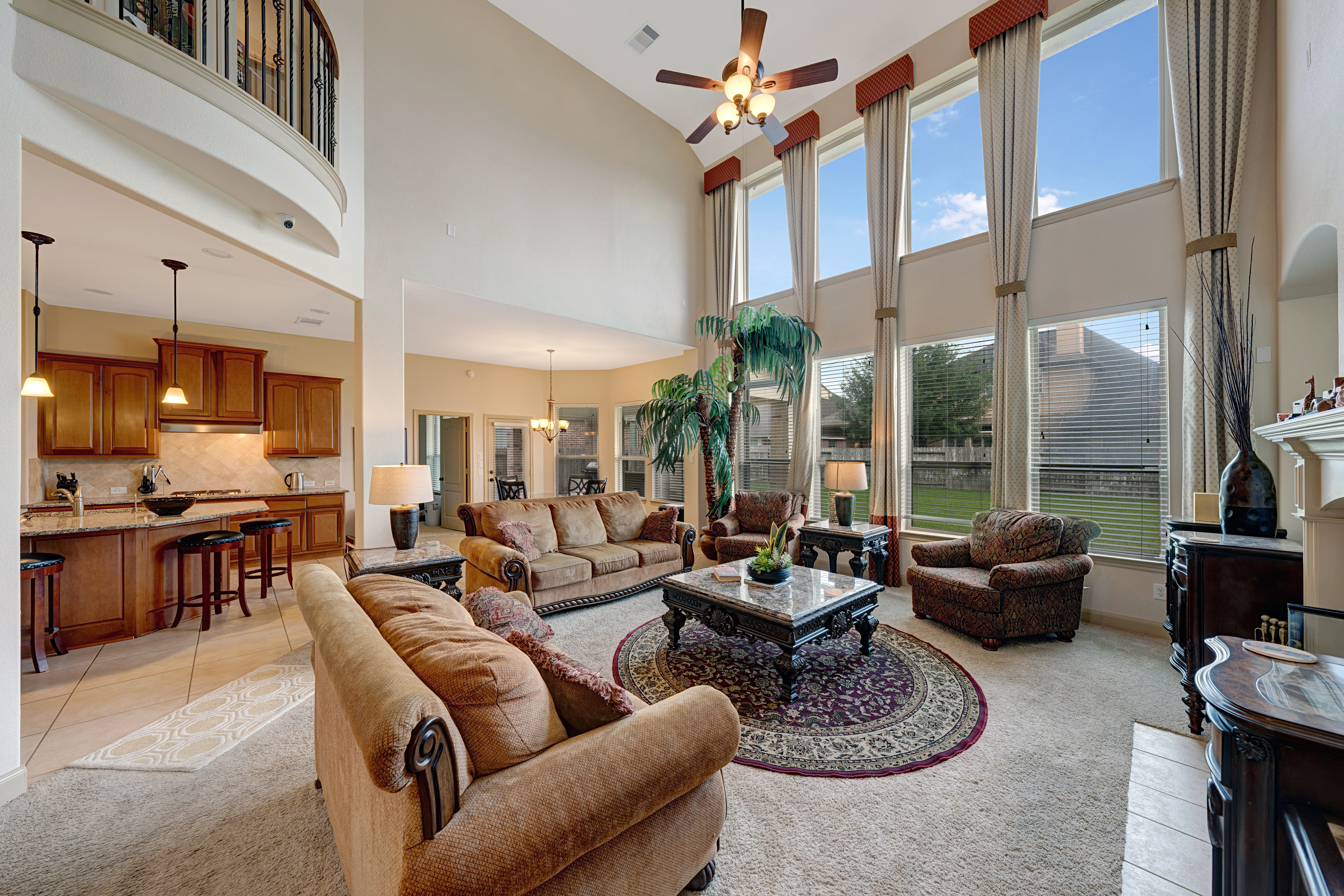 Two-story living room with balcony overlook