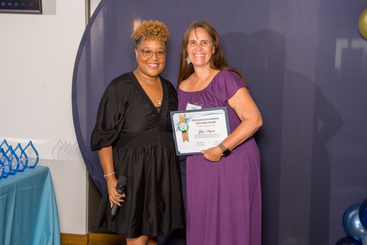 Award recipients posing with an Excellence in Learning Outcomes award