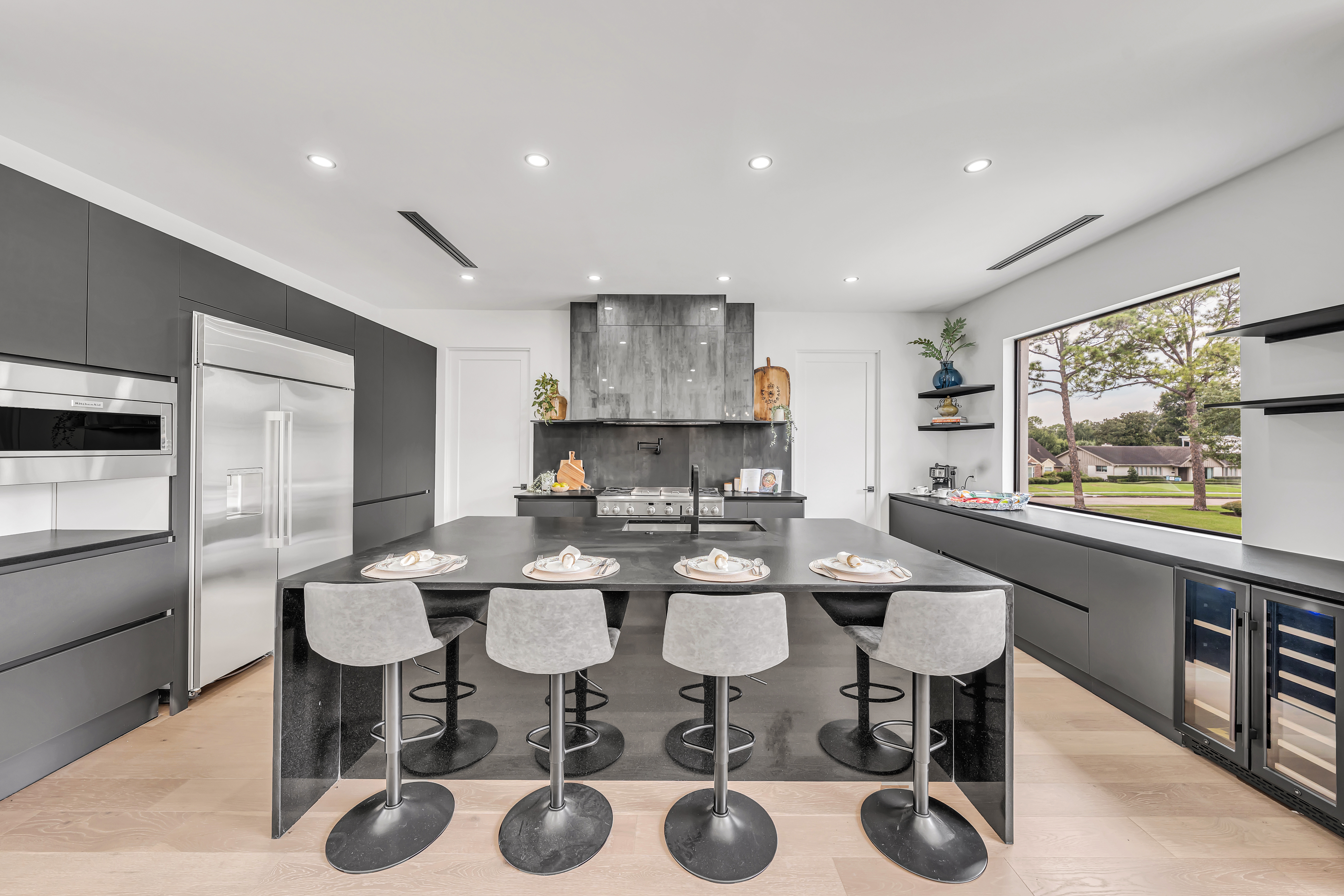 Dark modern kitchen with waterfall island