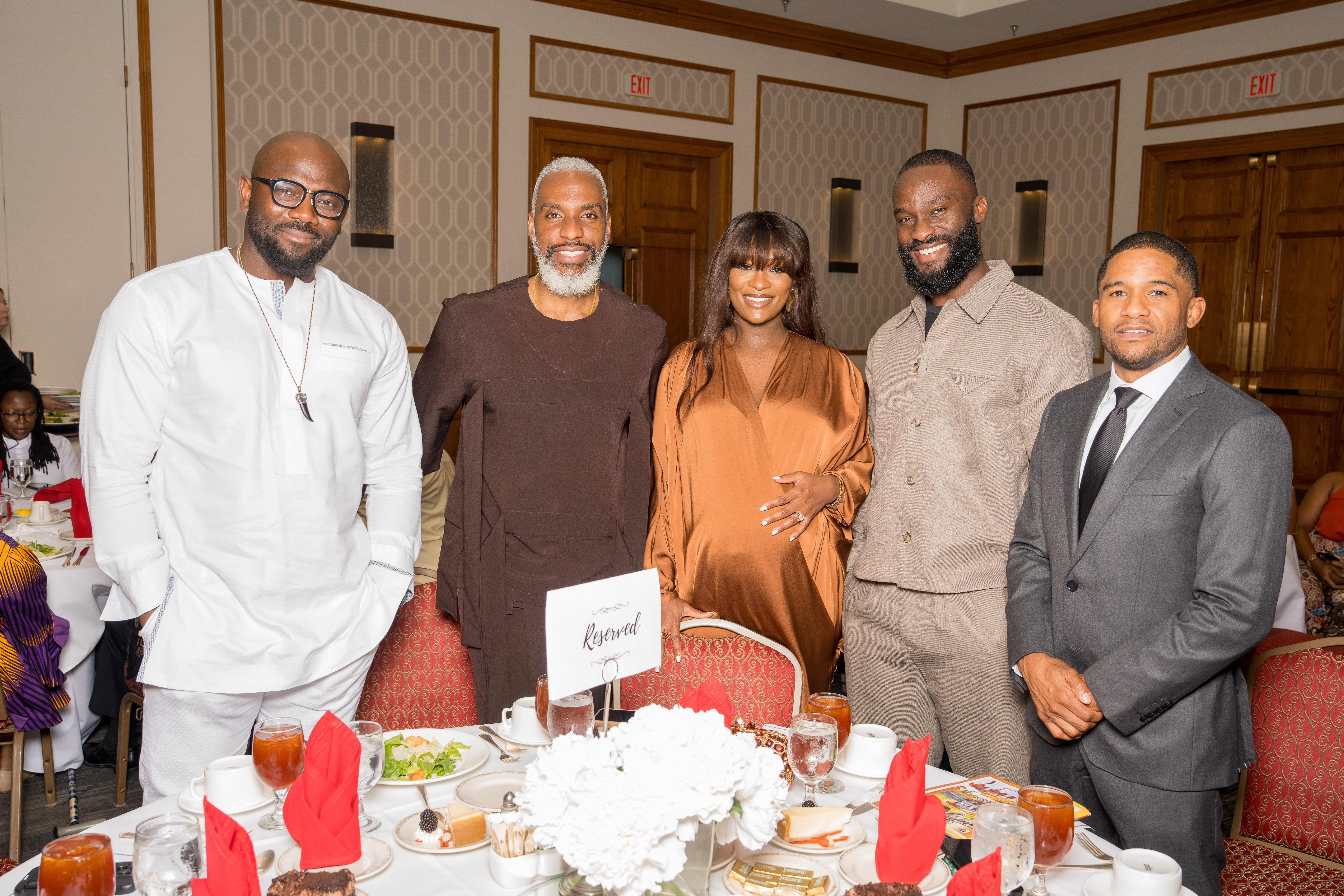 Group of guests posing together at a corporate gala