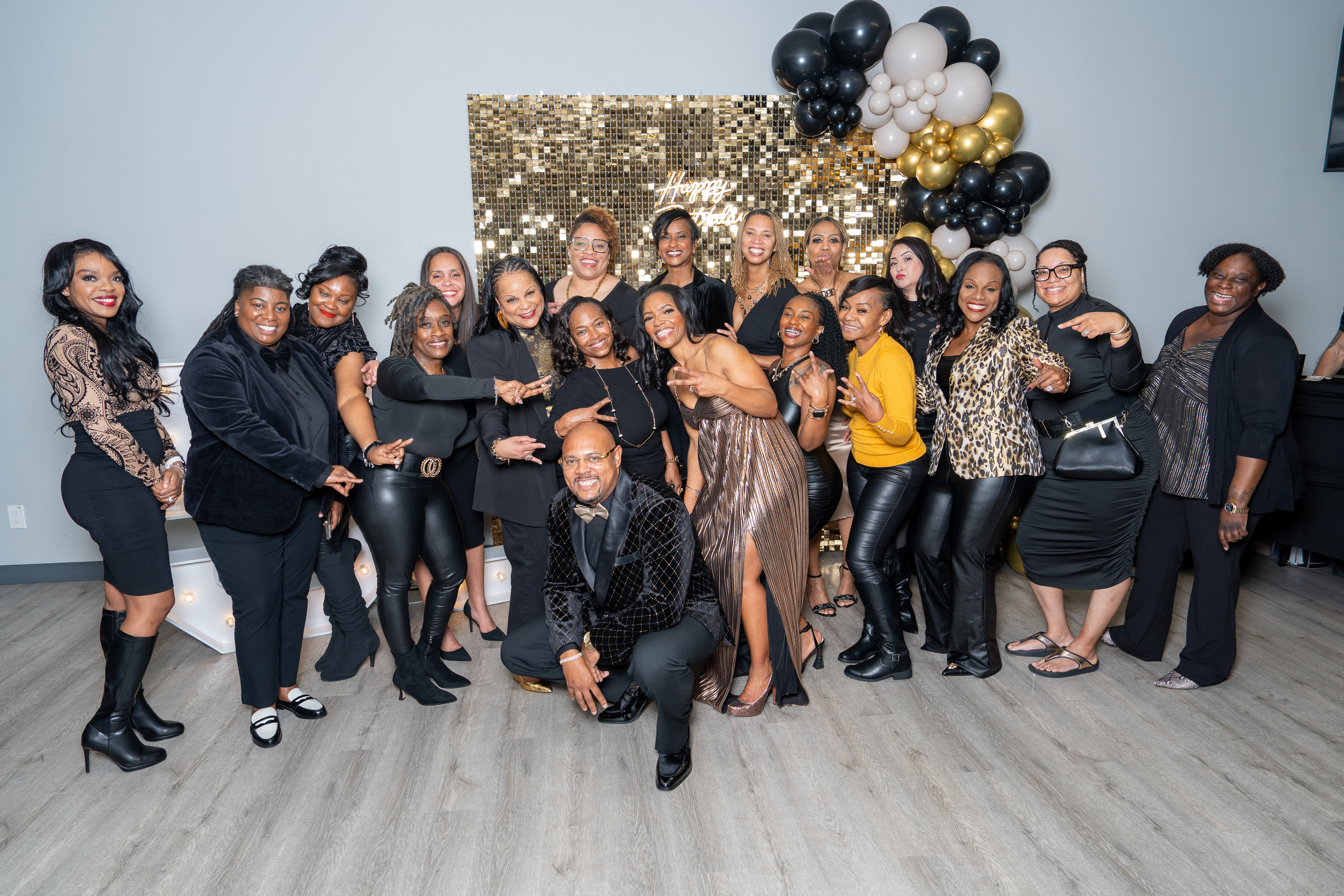 Group of guests posing together at a baby shower