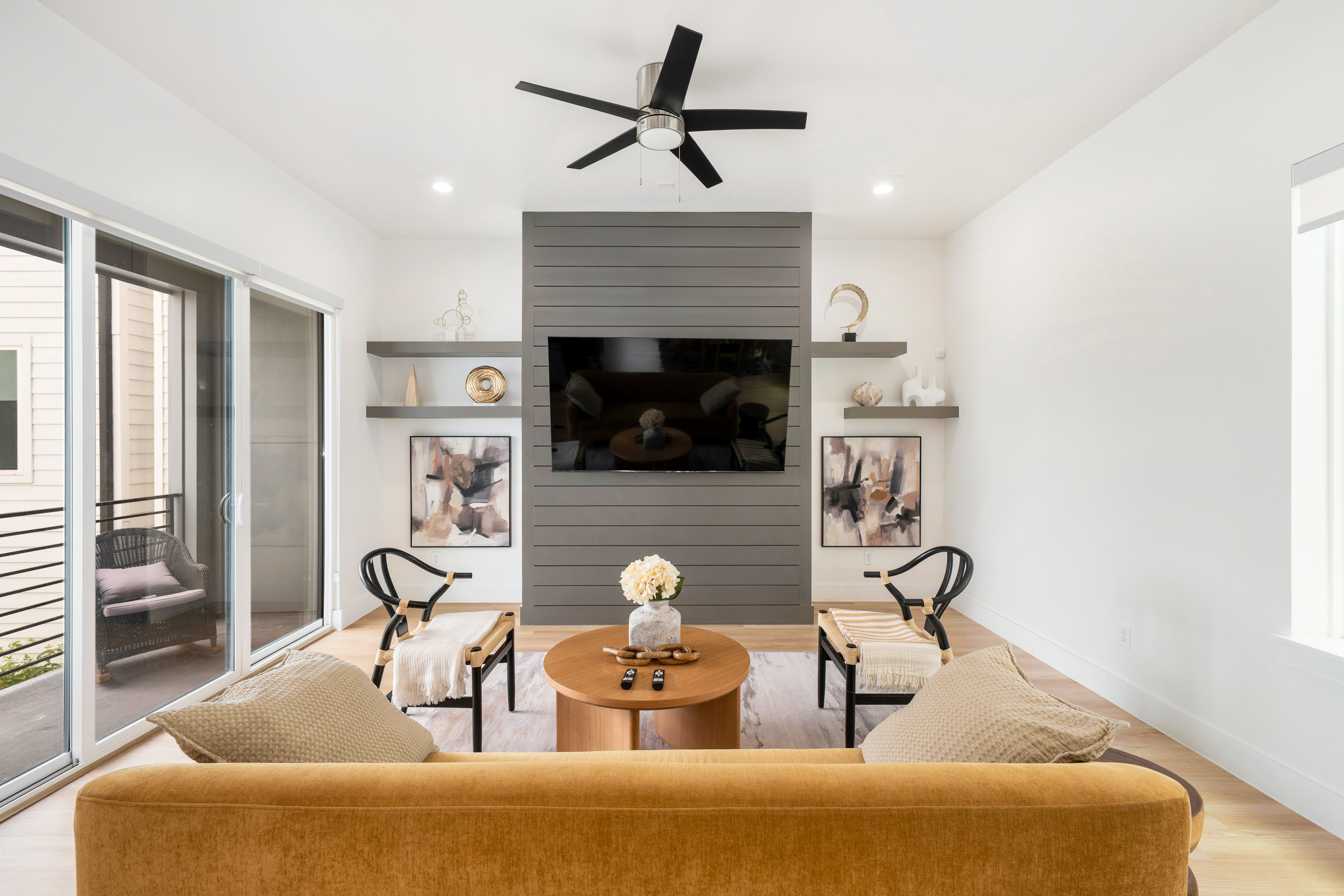 Living room with gray accent wall and mounted TV
