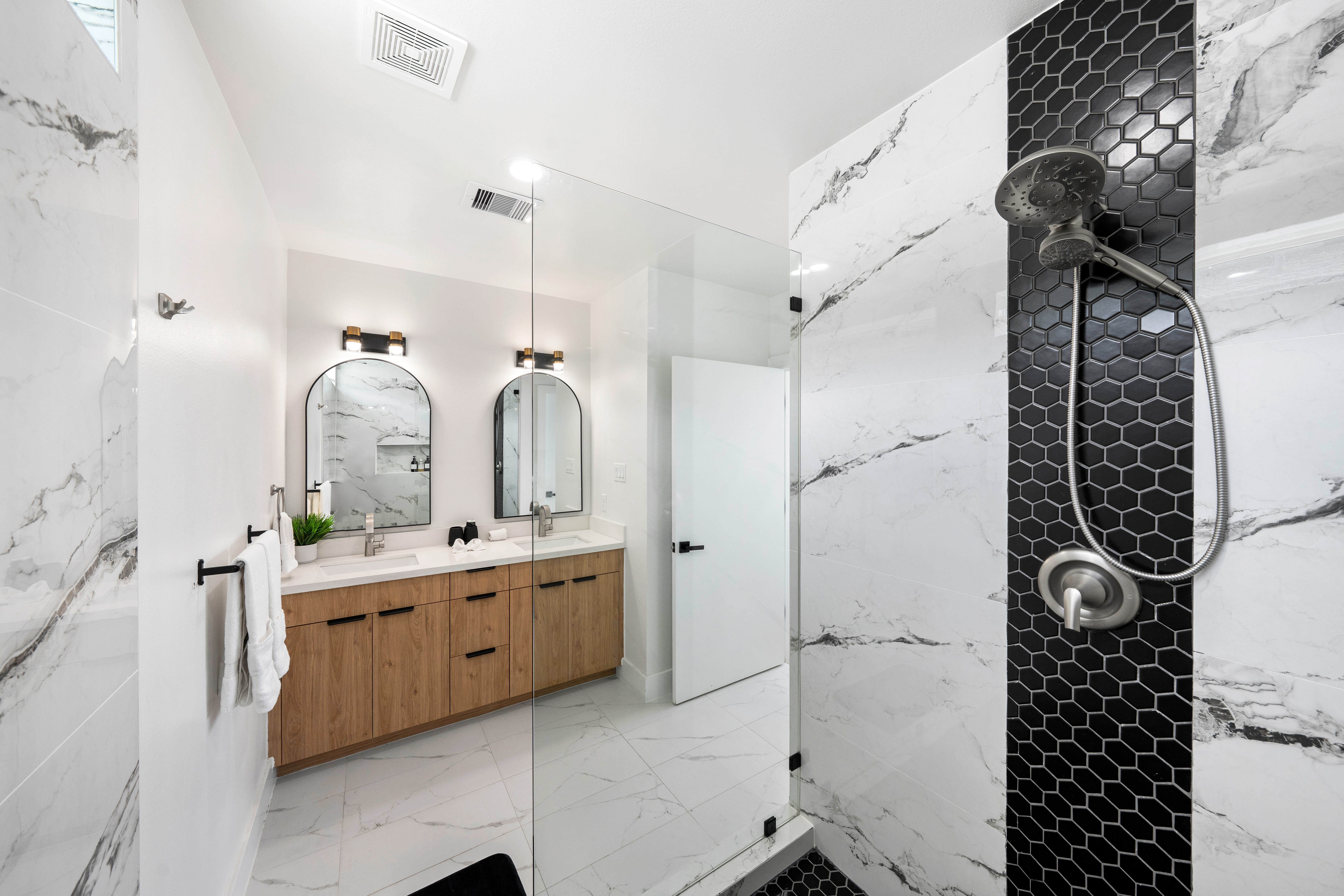 Modern bathroom with black hexagon tile shower