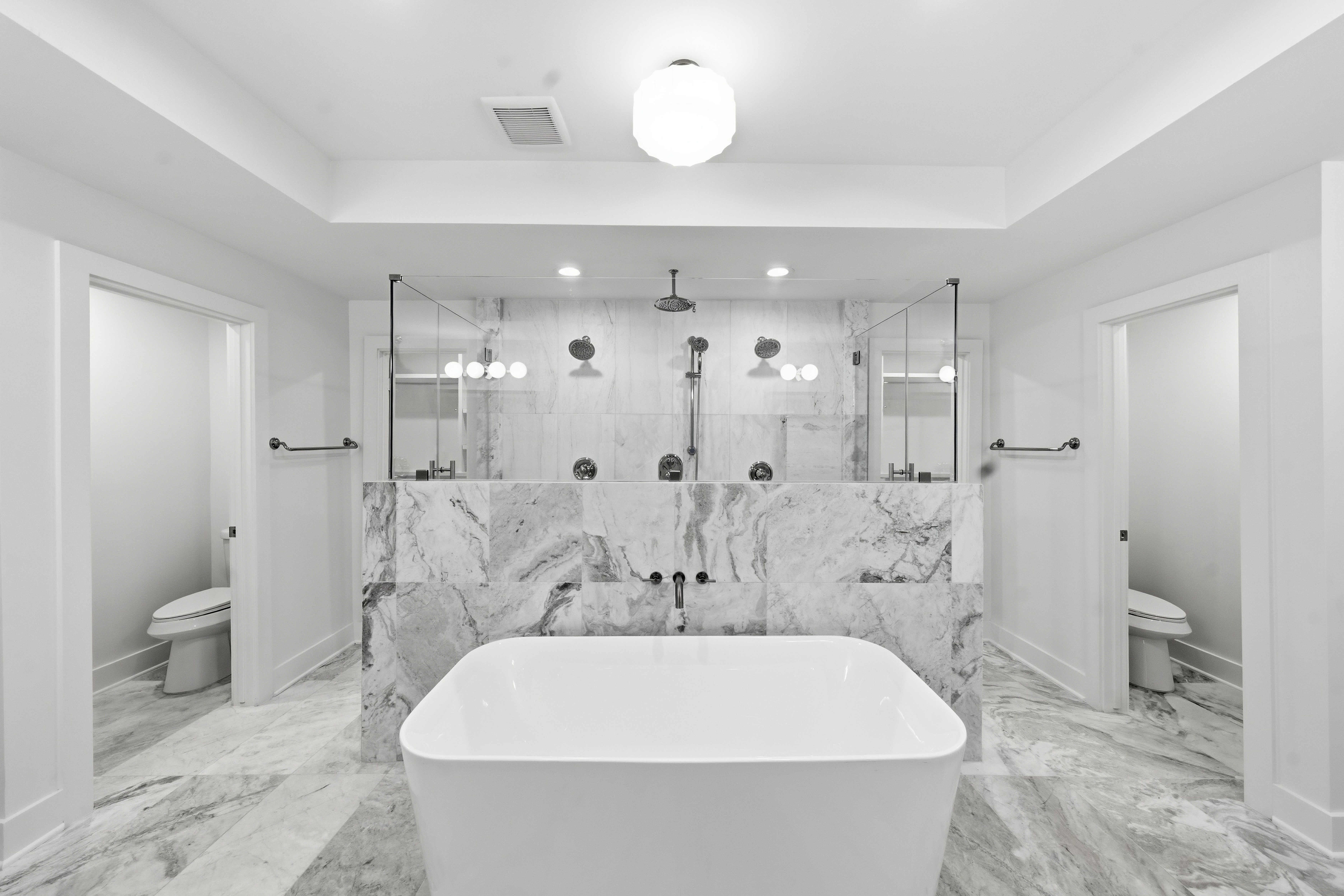 All-marble bathroom with dual toilet rooms