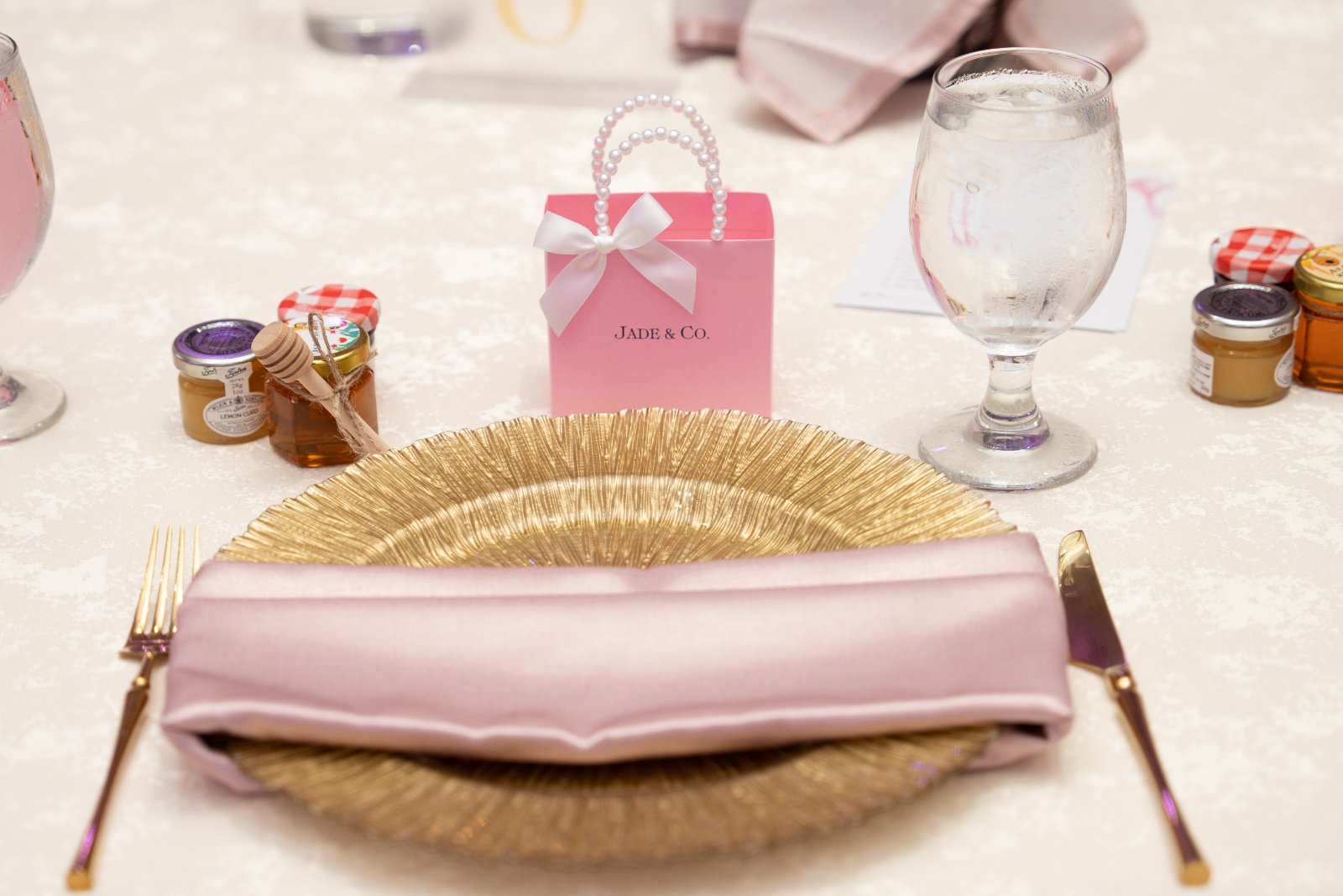 Elegant place setting and gift box photographed at a private celebration