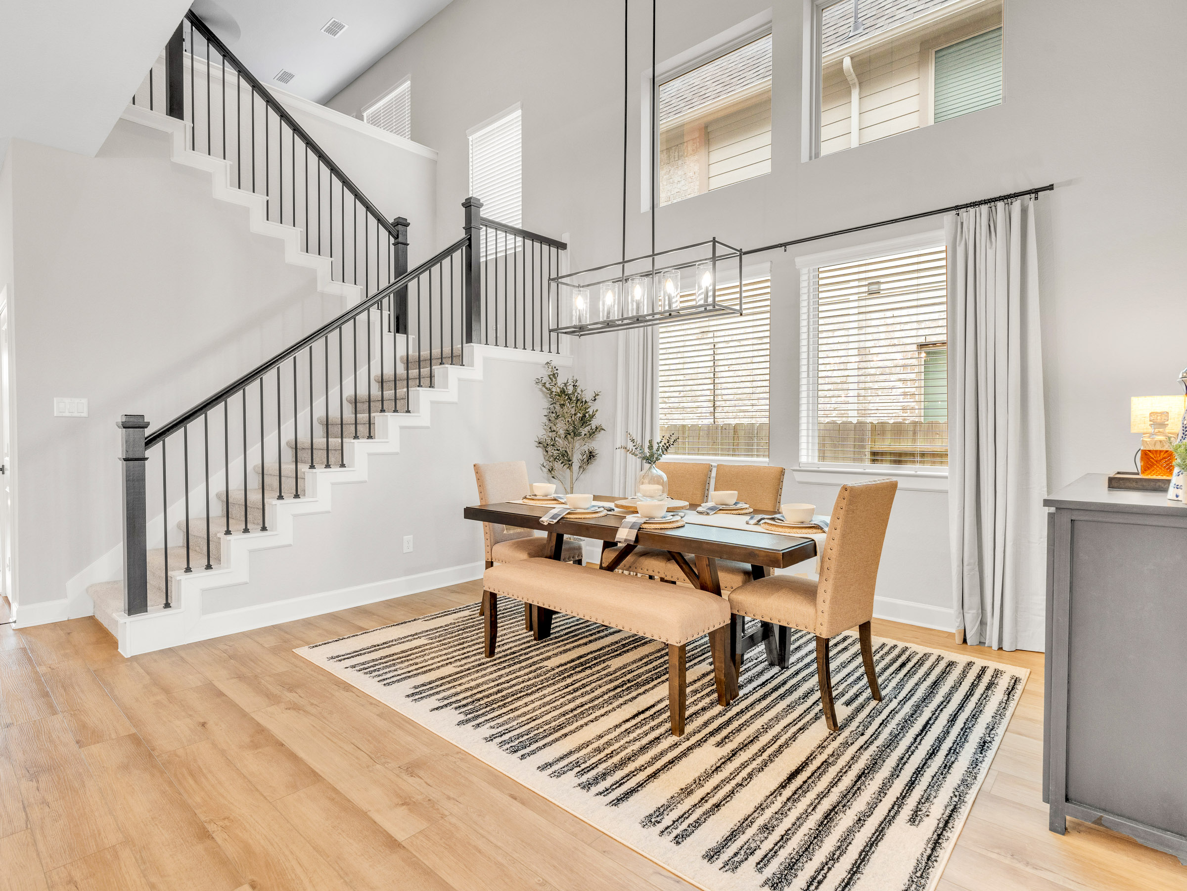Living room with white stone fireplace and orange accent chairs