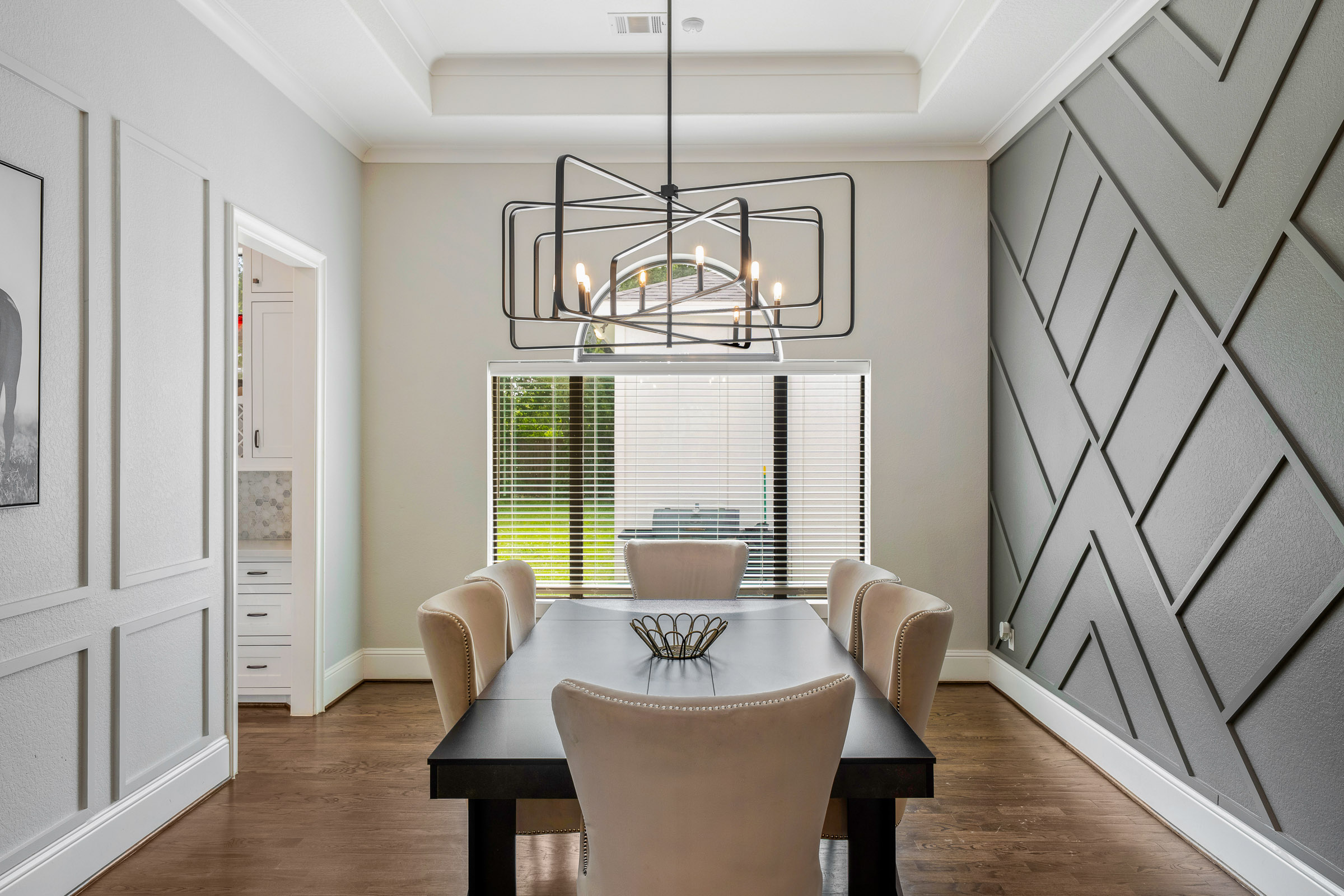 Covered balcony with patio dining set and townhome views